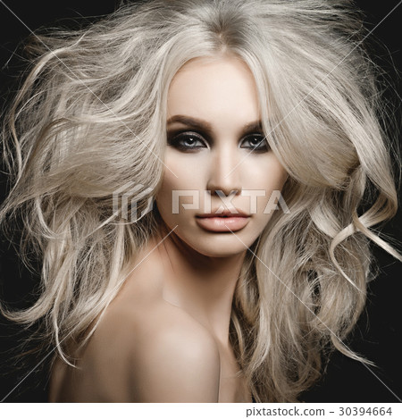 Beautiful blonde woman with volume hairstyle Beautiful blonde woman with volume hairstyle 30394664