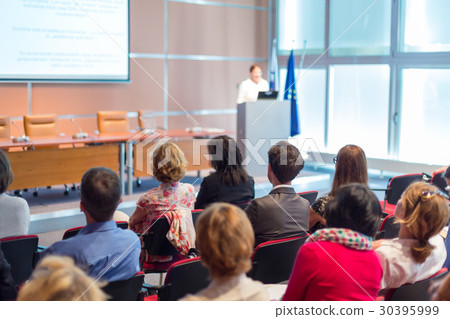 Speaker giving presentation on business conference 30395999