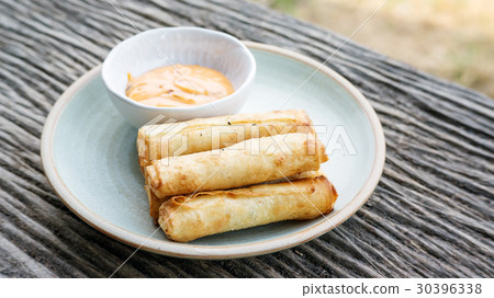 deep fried spring roll on a wooden table. deep fried spring roll on a wooden table. 30396338