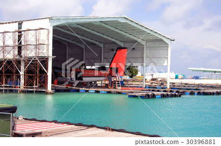 Maldives. A seaplane in a repair dock in port... 30396881