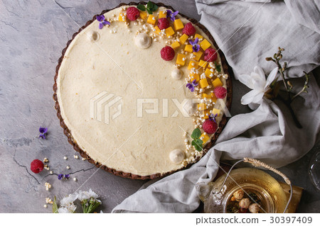 Chocolate tart with mango and raspberries 30397409