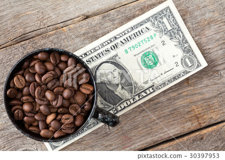 Cup of coffee beans on dollar banknote 30397953