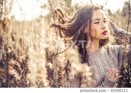 Fashion beautiful lady in autumn landscape 30398121
