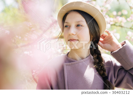 Portrait of a girl in a hat close-up of a spring 30403212