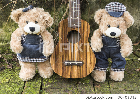 Teddy bears with ukulele on garden background Teddy bears with ukulele on garden background 30403382