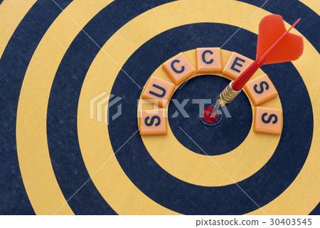 Dart hitting the bullseye target with word success Dart hitting the bullseye target with word success 30403545
