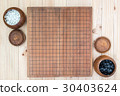two wooden bowls with empty go game board 30403624
