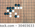 basic joseki in conner on go game board 30403633
