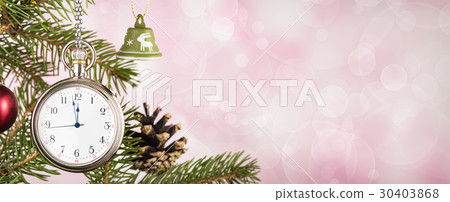 Pocket watch on Christmas tree branch on pink  30403868