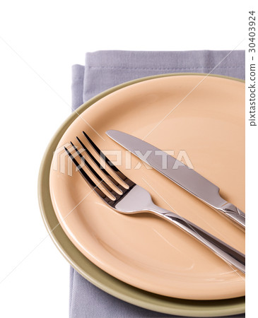Plates with silverware on gray napkin 30403924
