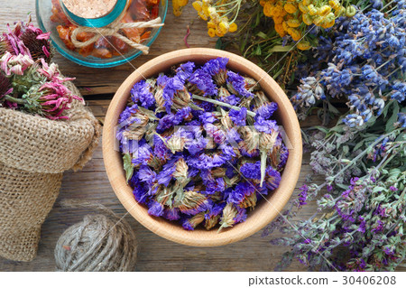Medicinal herbs, mortar and bag of flowers Medicinal herbs, mortar and bag of flowers 30406208