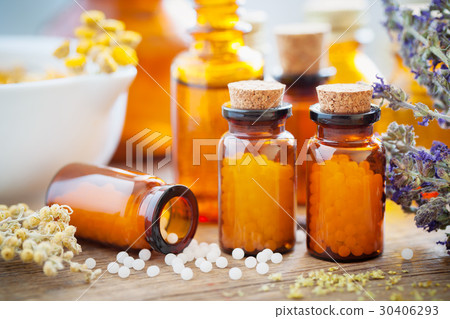 Homeopathic globules, mortar and healing herbs 30406293