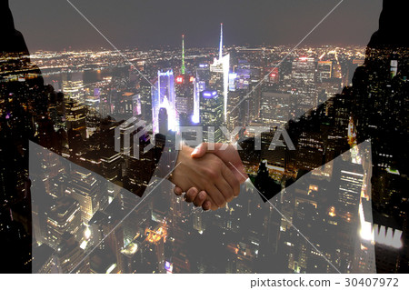 Double exposure Business hand shake city at night 30407972