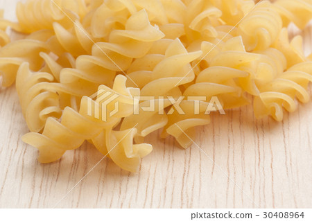 uncooked great italian fusilli on wooden board 30408964