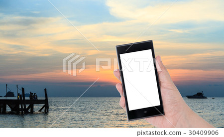 Hands holding smartphone with Colorful sky Hands holding smartphone with Colorful sky 30409906