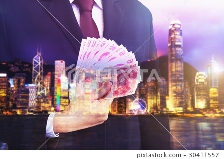 Business man holding Chinese money (RMB) Business man holding Chinese money (RMB) 30411557