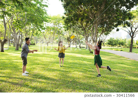 Playing frisbee Playing frisbee 30411566