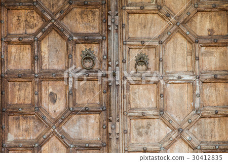 Wooden door with ancient floral patten.  30412835