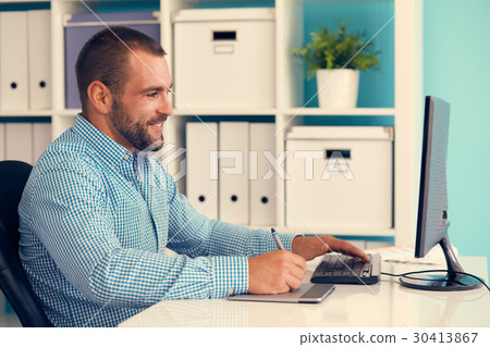 Graphic designer at work, toned Graphic designer at work, toned 30413867