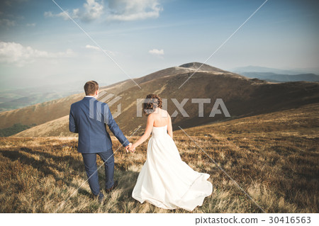 Happy beautiful wedding couple bride and groom at Happy beautiful wedding couple bride and groom at 30416563