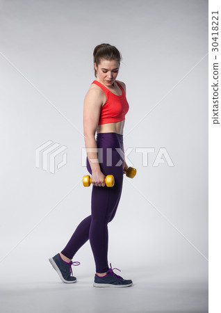 Sporty woman posing on white background 30418221