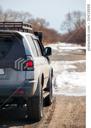 Cross country vehicle on dirt road 30418898