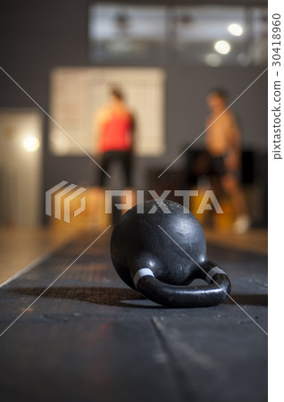 Kettlebell lying on the floor in gym Kettlebell lying on the floor in gym 30418960