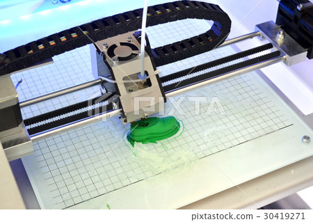 3D printer prints the form of molten plastic green 30419271