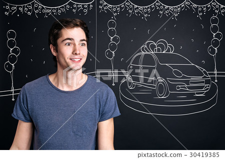 Cheerul smiling man standing near car Cheerul smiling man standing near car 30419385
