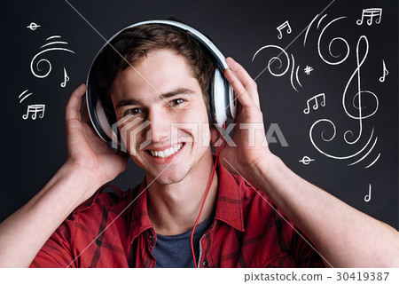 Positive delighted man listening to music 30419387
