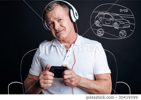 Upset adult man playing video games 30419399