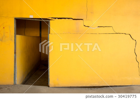 Old cracked yellow concrete wall 30419775