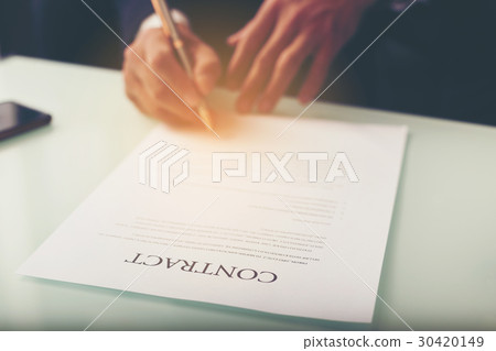 Business man signing a contract Business man signing a contract 30420149