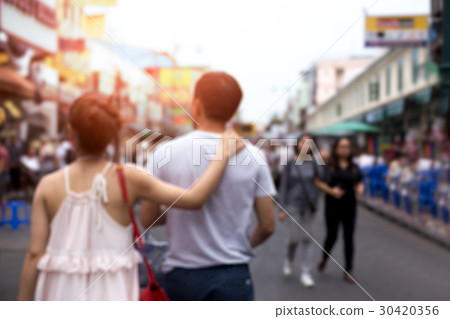 Blurred concept couple walking down the street Blurred concept couple walking down the street 30420356