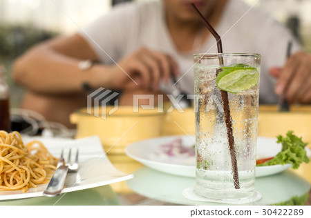 Man having glass of fresh sparkling mineral water 30422289