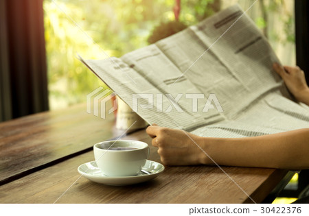 Business people and coffee and reading newspaper Business people and coffee and reading newspaper 30422376