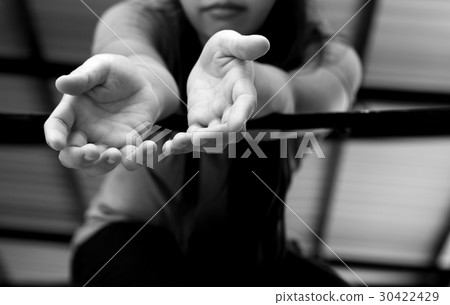 Woman victim hand reach out for help  30422429