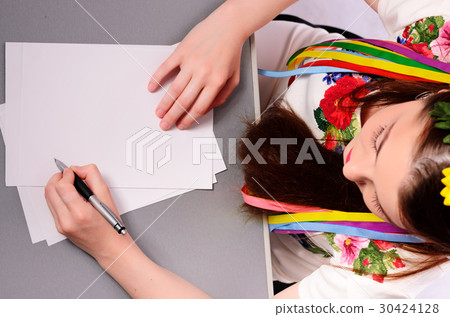 Happy businesswoman with note and pen Happy businesswoman with note and pen 30424128