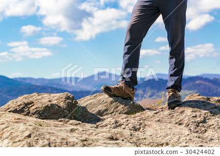 Man at the edge of a cliff 30424402