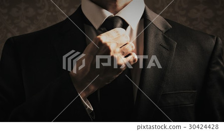 Businessman adjusting his look 30424428