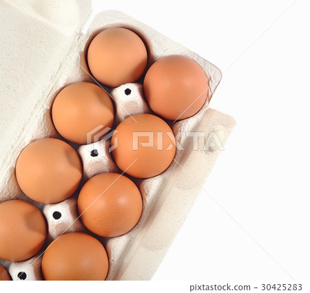 Carton of fresh brown eggs on a white Carton of fresh brown eggs on a white 30425283
