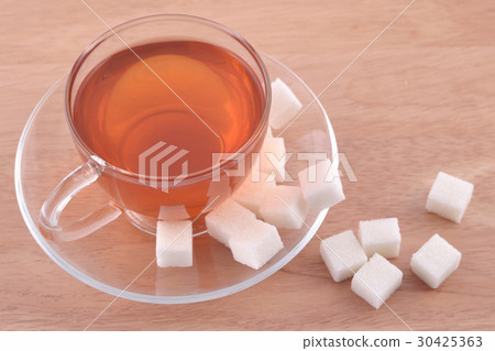 Cup of tea and refined sugar 30425363