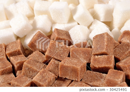 Heap of brown and white refined sugar 30425491