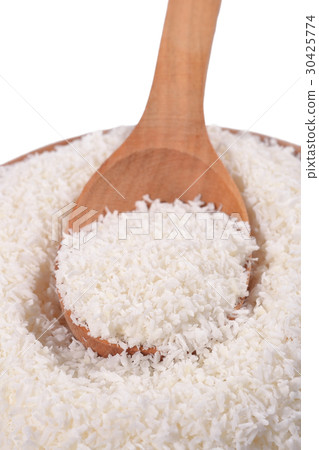 Shredded coconut in a wooden spoon 30425774