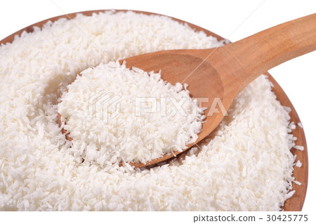 Shredded coconut in a wooden spoon Shredded coconut in a wooden spoon 30425775