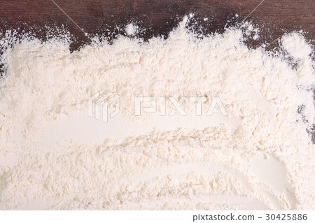 White flour on a wooden background White flour on a wooden background 30425886