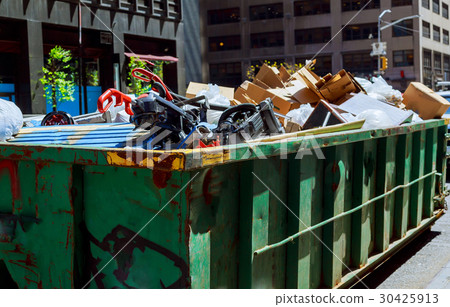 Over flowing Dumpsters being full with garbage 30425913