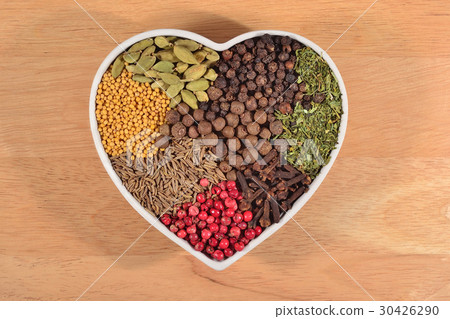 Different dry spices in plate in form of heart Different dry spices in plate in form of heart 30426290