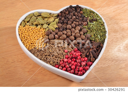 Different dry spices in plate in form of heart Different dry spices in plate in form of heart 30426291