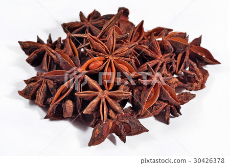 Heap of star anise on a white 30426378